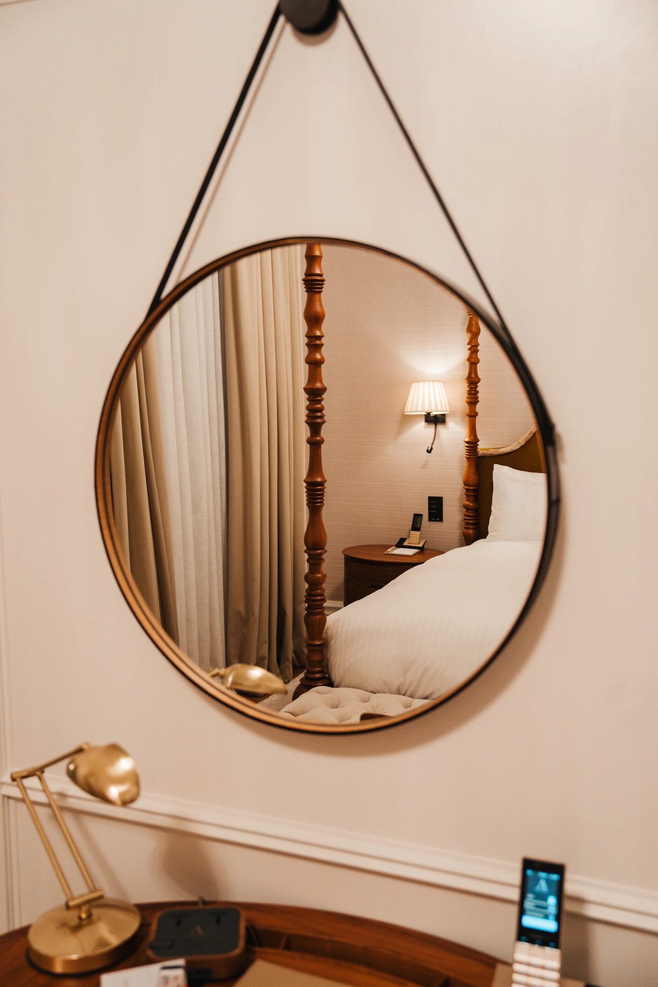 A round mirror and interior details at The Adria